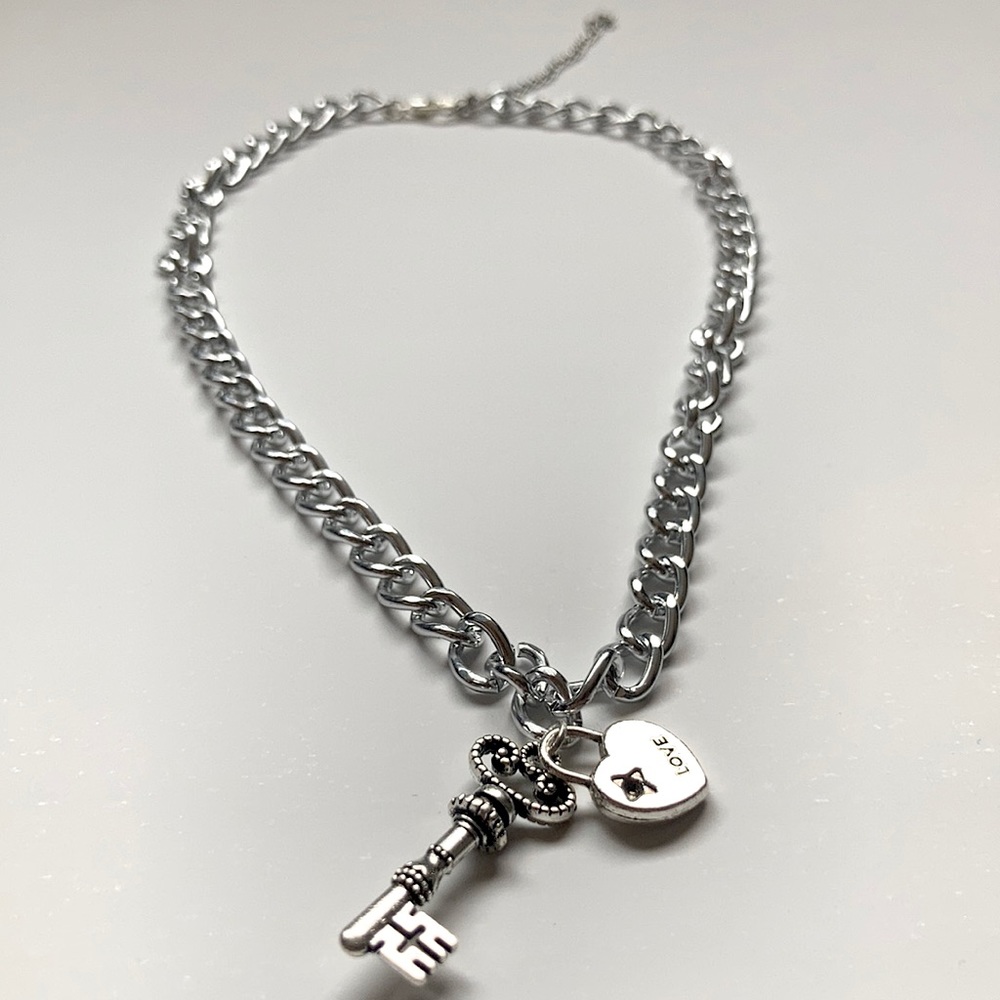 a thick chain necklace with a heart and key charm!